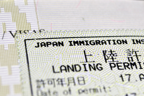 immigration control passport stamp issued in Japan; focus on Japan Immigration phrase