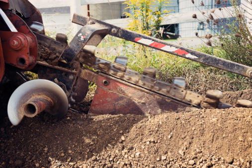 Trenching! Red machine in action.