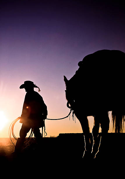 istock Young Cowboy and His Horse 177037805