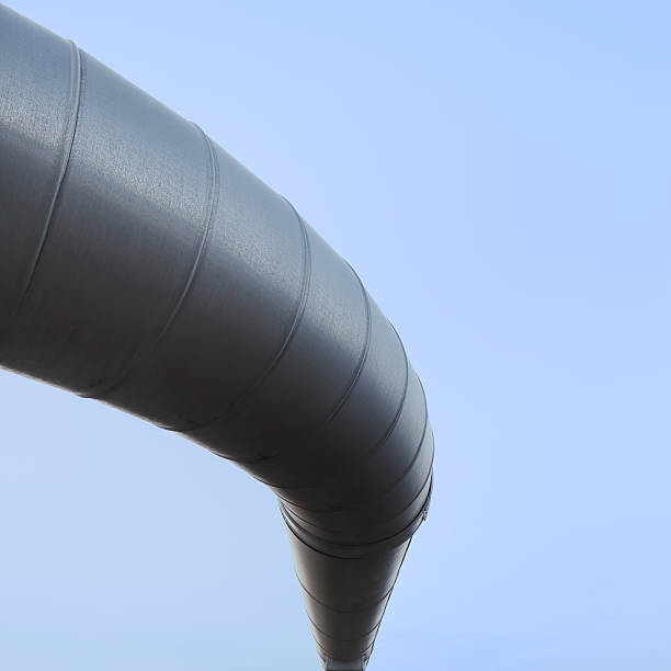 istock Curved industrial pipe line, sky background. Geothermal power plant. 177039043