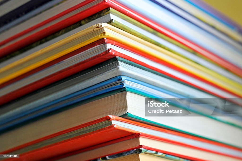 Stack of various colored and sized books some color books on the shelf Picture Book Stock Photo