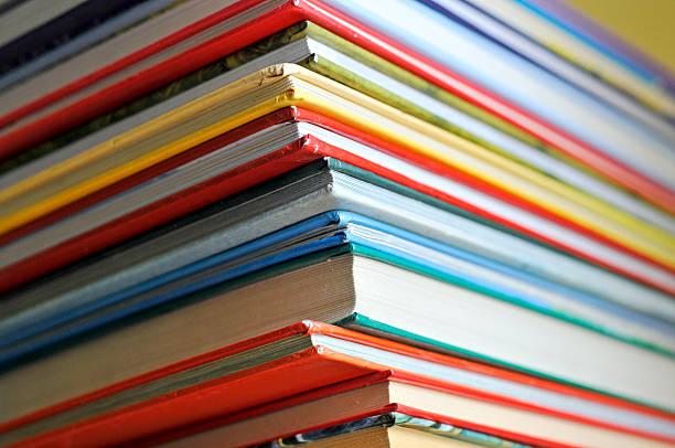 Stack of various colored and sized books some color books on the shelf guest book photos stock pictures, royalty-free photos & images