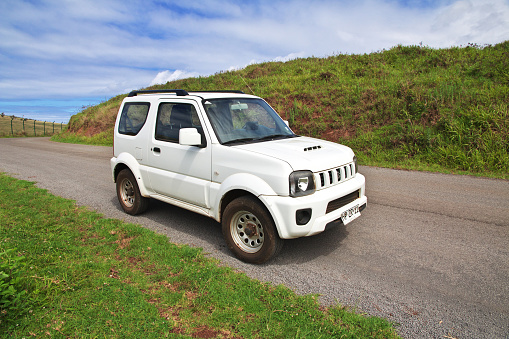 Berlin, Germany - 21 August, 2020: Suzuki Jimny on a road near the lake. This vehicle is used to get in extremely hard areas.