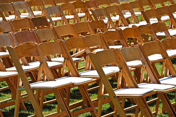 istock Rows of wooden chairs on lawn 177040484