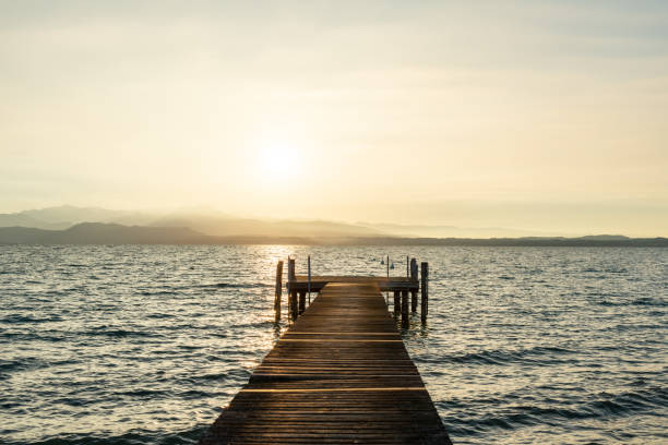 istock Pier on Garda lake at sunset, meditation background 1770407653