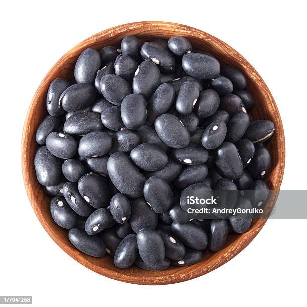 Wooden Bowl Full Of Black Small Beans Isolated On White Stock Photo - Download Image Now