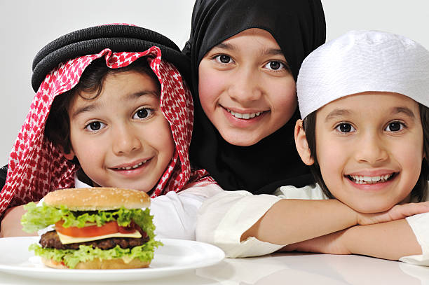 Happy little Muslim kids playing with sheep toy - celebrating Eid ul Adha - Happy Family celebrating Sacrifice Feast