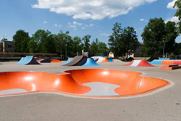 Photo of Empty colorful skatepark on a sunny day