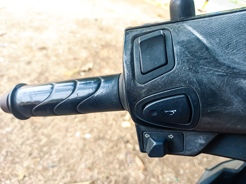 The left handle of a motorbike.