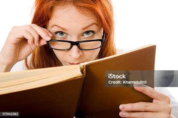 Beautiful Redhaired Girl In Glasses Reads Book Stock Photo - Download Image Now - Adult, Adults Only, Beautiful People