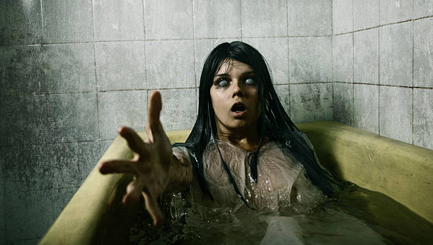 Scary girl in bath "Scary girl in bath stretching her hand to camera, Halloween theme Business and communication" girls bath stock pictures, royalty-free photos & images