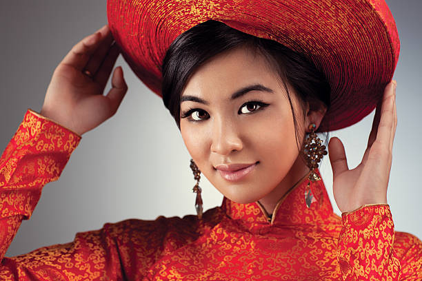 Young vietnamese woman in traditional clothing portrait.