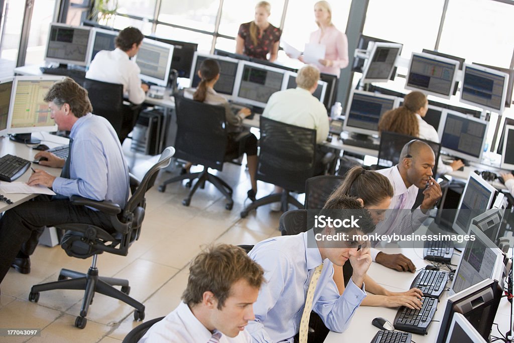 Busy stock traders in office View Of Busy Stock Traders Office In Day Time Office Stock Photo