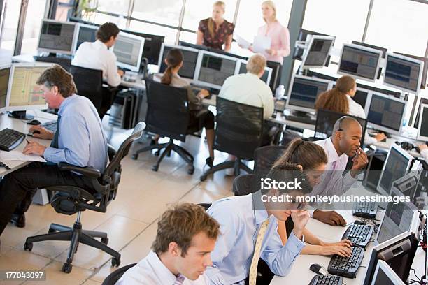 Busy Stock Traders In Office Stock Photo - Download Image Now - Office, Busy, Trader