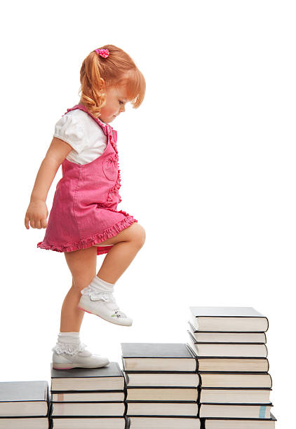 piccolo passo per grande futuro - book child staircase steps foto e immagini stock