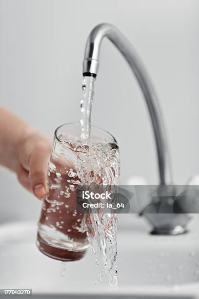 Glass Pouring Fresh Drink Water Stock Photo - Download Image Now - Water, Faucet, Drinking Glass