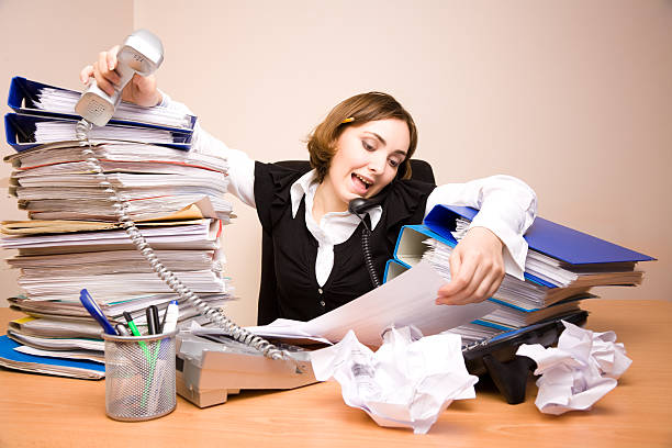 istock Young businesswoman with tons of documents 177043489