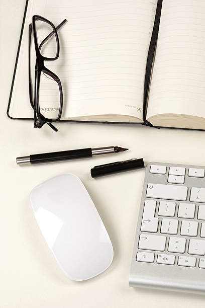 istock Businessman desk with notebook, glasses, pen, mouse and keyboard 177043738