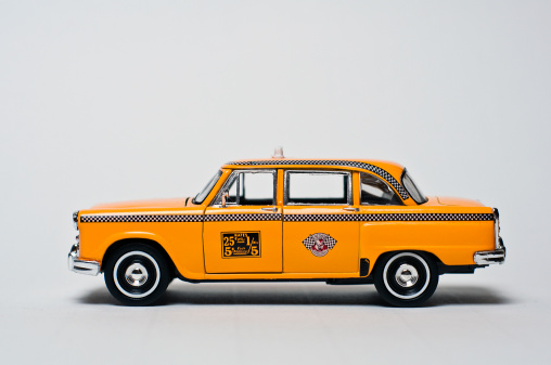 Yellow toy taxi