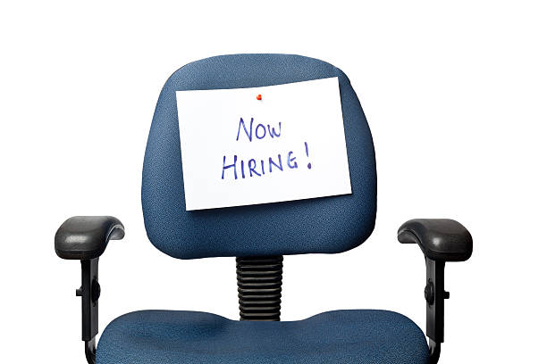 istock Office chair with hand written 'NOW HIRING!' sign on back 177043913