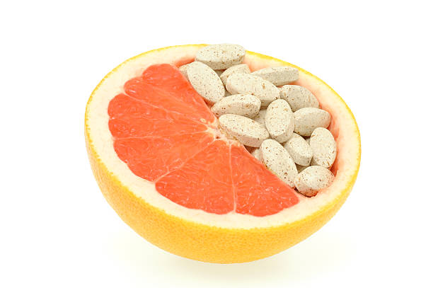 istock Close up of grapefruit and pills isolated 177044064
