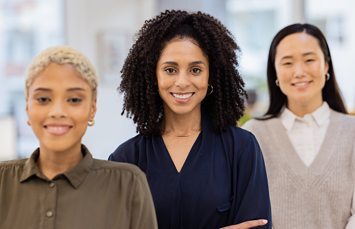 Black woman, portrait smile and diversity in leadership, teamwork or vision at the office. Diverse group of happy employee women smiling for career goals, values or proud team at the workplace
