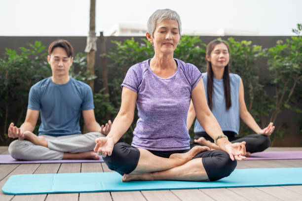 istock Group of people meditating outdoor 1770450862