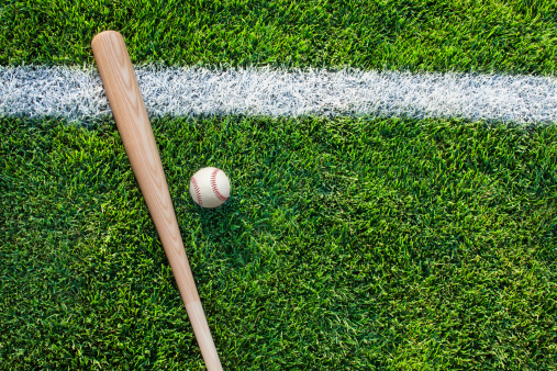 Top view of baseball bat and ball on grass with white stripeSome others you may also like: