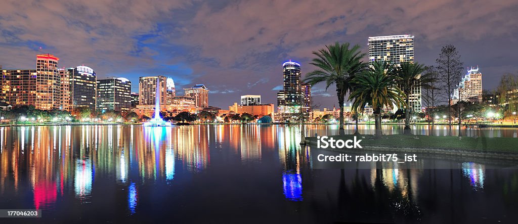 A landscape panorama of the city of Orlando at night Orlando Lake Eola panorama with office buildings at night Orlando - Florida Stock Photo