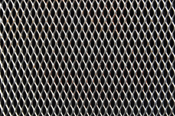 perforated metal background stock photo