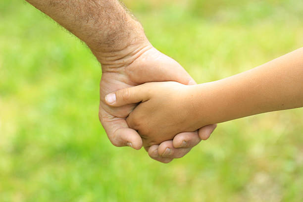 istock two arms of father and son 177046504