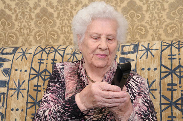 istock Senior woman dials the phone 177046531