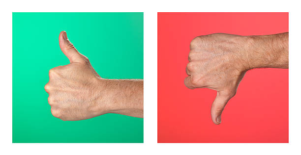 istock Thumbs Up Down Signs on Green and Red Background 177046615