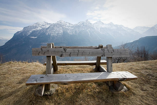 istock wooden bench on the alps 177046795