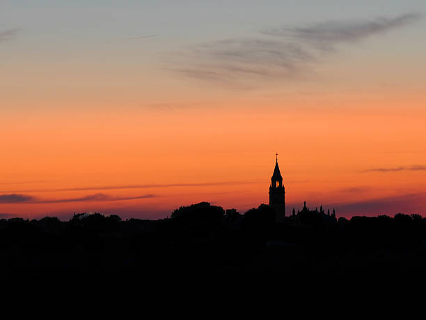 Sunet over town stock photo