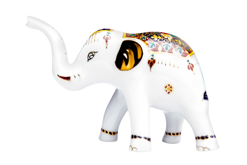 Papier mache elephant painted with one gesso layer.