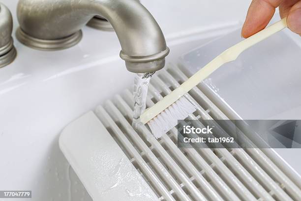 Hand Cleaning Fan Vent Cover In Sink Stock Photo - Download Image Now - Air Duct, Dusting, Chores