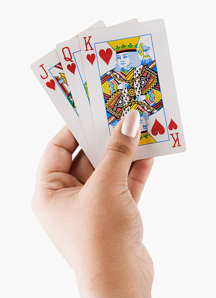 istock woman's hand holding playing cards 177048521