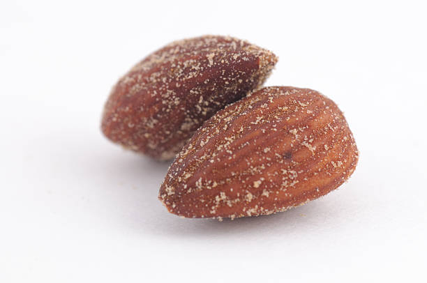 Salted roasted smoked Almonds stock photo