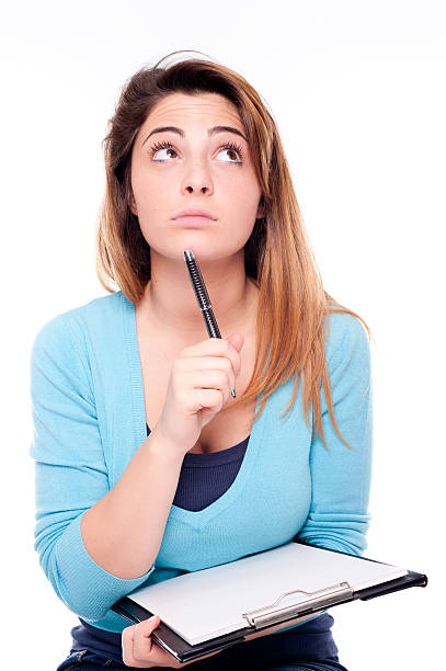 istock Young thinking woman writing on white background 177048951
