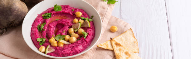 istock Homemade Beetroot hummus on white table, copy space 1770491678
