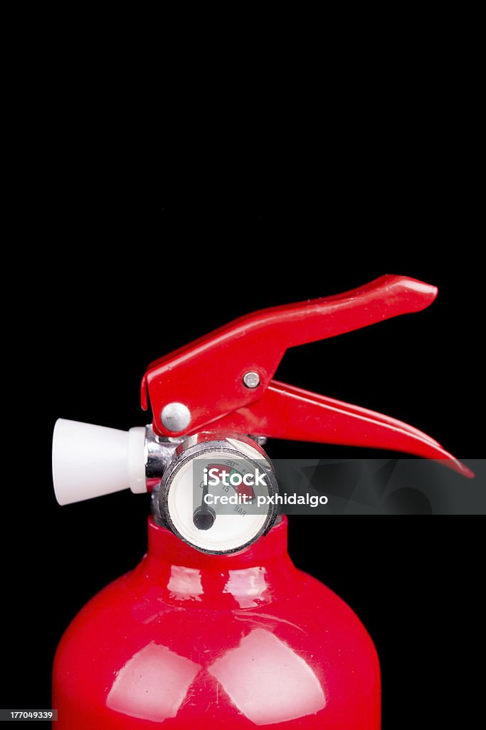 Vermelho de Extintor de Incêndio isolado em um fundo preto - Royalty-free Acidente - Conceito Foto de stock