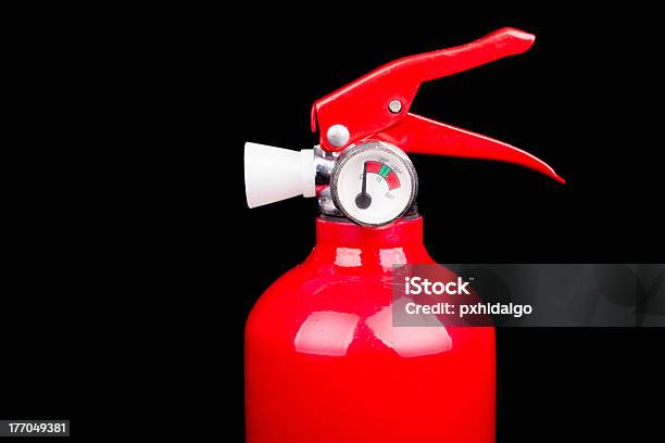 Extintor De Fuego Roja Aislada Sobre Un Fondo Negro Foto de stock y más banco de imágenes de Bomba de combustible