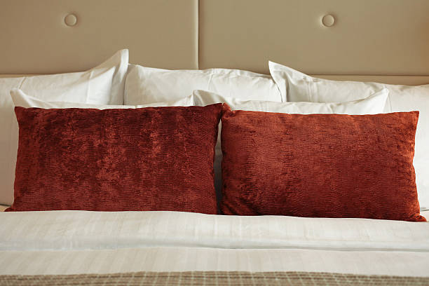 istock Hotel bed arrangement pillows detail 177049451