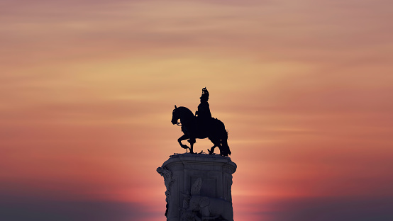 Silhouette of statue of King Jose statue in the Praca da Figueira square in Lisbon, Portugal