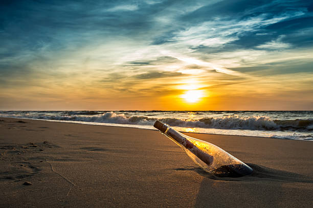 istock Message in a bottle against the setting sun 177050482