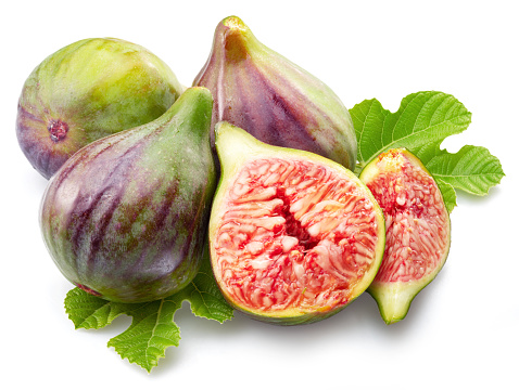 Fig fruits and slices of fig isolated on white background.