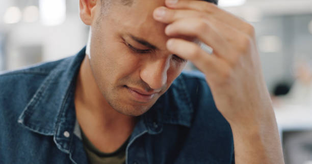 istock Man, face and headache in mistake, stress or burnout from mental health problems at office. Frustrated male person or tired employee with migraine, anxiety or depression in financial crisis or debt 1770522260
