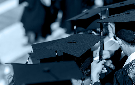 Group of graduates standing in together