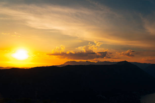 istock Orange sunset in the sky over a mountain range 1770533508